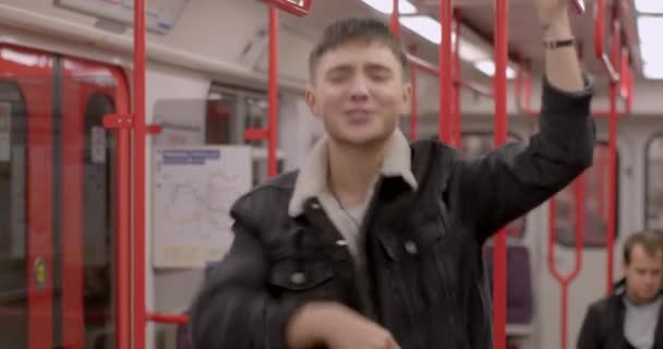 Sings Rap Song Subway Car Hand Makes Gestures Holds Handrail — Vídeos de Stock