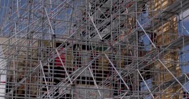 Metal structure made of pipes and rods. An engineering structure for attaching scene details. The repairman man moves inside CZ, Milovice, 7.8.22 Let it Roll