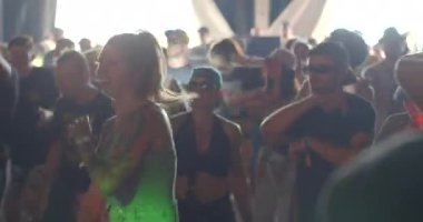 Active girl dancing on the dance floor. She moves her hips, her body. Physical activity in dance. Light hair movement. Colored light. CZ, Milovice, 7.8.22 Let it Roll