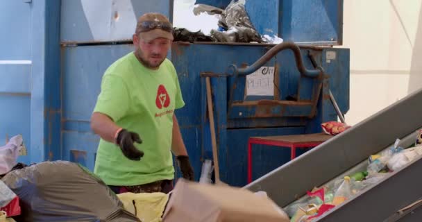 Garbage Recycling Worker Unpacks Plastic Waste Sorts Paper Plastic Carpet — Vídeo de stock