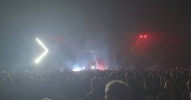 Red color light show at the concert. scene performance red light. Flashing light, movement of light strips. Night entertainment for adults. CZ, Prague, Stromovka, 14.7.22