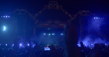 Electronic stage of the music festival. Light creates atmosphere. Scene glowing lights, upward movement of smoke, visual effects favorite music Light show CZ, Milovice, 6.8.22 Let it Roll