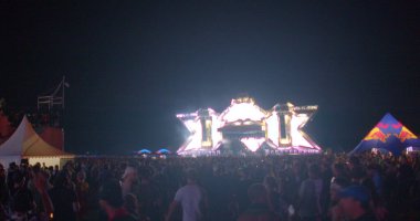 Electronic stage of the music festival. Light creates atmosphere. Scene glowing lights, upward movement of smoke, visual effects favorite music Light show CZ, Milovice, 6.8.22 Let it Roll