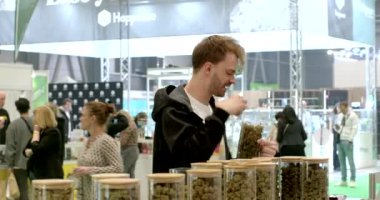 Man tests CBD products at an exhibition selling medicinal plants and marijuana. Products containing cannabidiol are gaining popularity in Europe. 5.11.2023 Letnany, Prague, CZ 