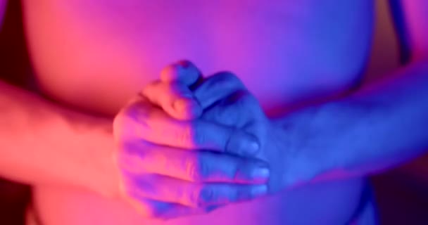 Shirtless Man Rubs His Hands Glow Red Blue Flashing Lights — Stock video