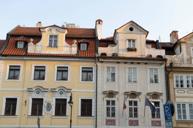 The colorful facades of the historic buildings in a charming European city beautifully showcase a diverse range of architectural styles and intricate urban design elements found throughout clipart