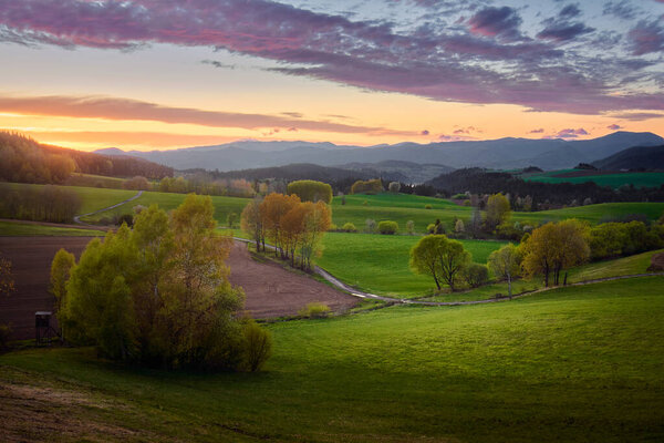 Rural landscape during the beautiful spring sunset in central Slovakia