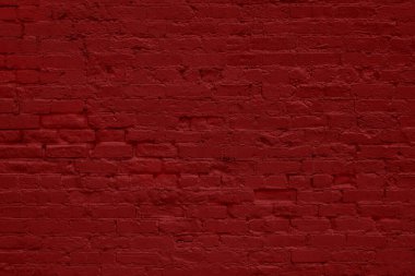 Kırmızıya boyanmış grunge tuğla duvarın yakın çekimi