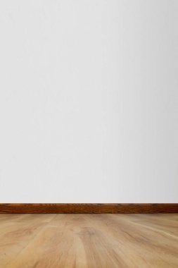 Boş ahşap döşemeli ve hafif desenli duvarlı boş bir oda. Özgeçmiş ve maketler için mükemmel. Kopyalama alanı çok.