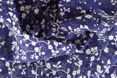 Close-up of abstract floral fabric in blue and white. Ideal for backgrounds, banners, and editorial use.
