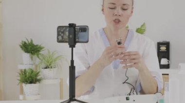 Female cosmetologist is giving online consultation. 