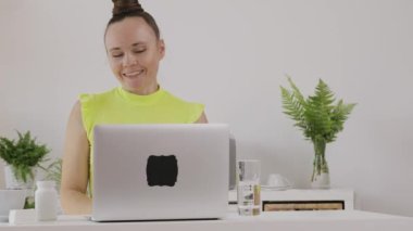 Young female coach is giving online consultation. 
