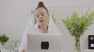 Young fashion designer gives online consultation. 