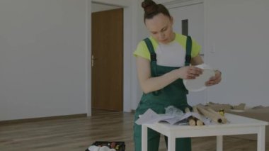 Female is assembling flower stand. High quality 4k footage