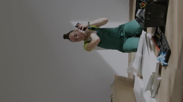Young Female Assembling Piece Furniture High Quality Footage — Stockvideo