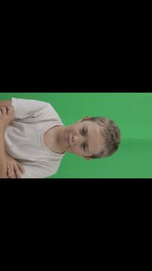 Boy of 9 years looks unhappy. Closeup. High quality footage