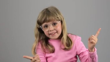 Girl of 7 years is dancing in front of the camera. High quality 4k footage