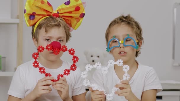 Two Children Clowns Bow Eye Glasses Keep Two Hearts High — Stockvideo