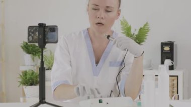 Female cosmetologist is giving online consultation. 
