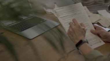 Family allowance form in German language in the hands of a female. High quality 4k footage