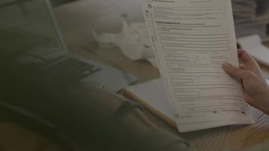 Family allowance form Familienbeihilfe in German language in the hands of a female. High quality 4k footage