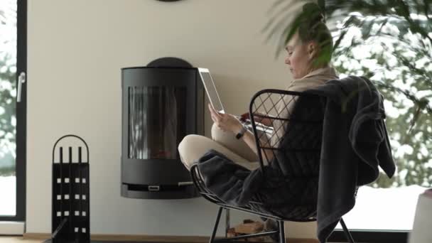 Female Sits Armchair Close Real Chimney Works Laptop High Quality — Stock Video