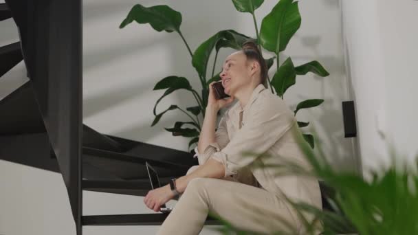 Female Speaks Phone Sitting Steel Stairs High Quality Footage — Vídeo de stock