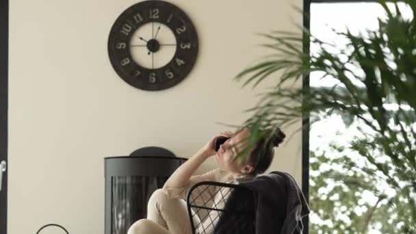 Female Sits Armchair Close Real Chimney High Quality Footage — Stock Video