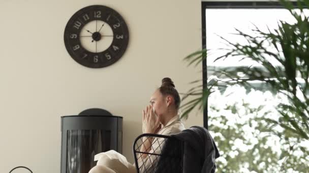 Female Sits Armchair Close Real Chimney Cleans Her Nose High — Αρχείο Βίντεο