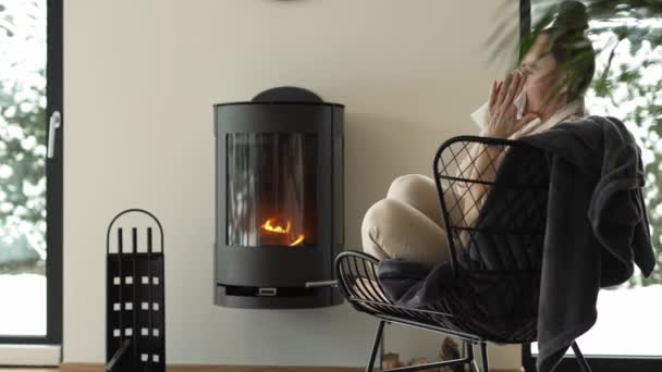 Female Sits Armchair Close Real Chimney Cleans Her Nose High — Stock Video