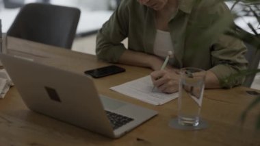 Family allowance form Familienbeihilfe in German language in the hands of a female. High quality 4k footage