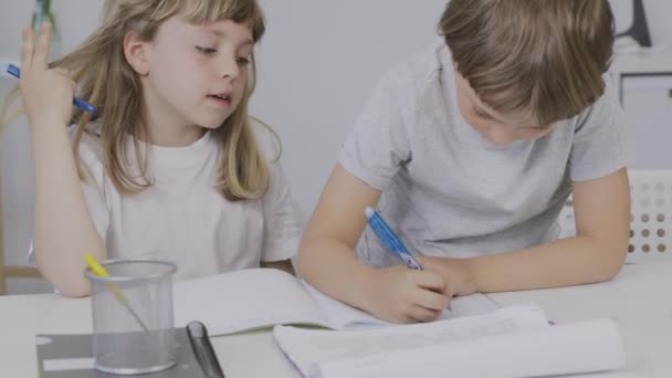 Boy Years Old Helps His Younger Sister Make Her Homework — 图库视频影像