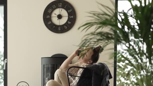 Female Sits Armchair Close Real Chimney High Quality Footage — Stock Video