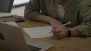 Family allowance form Familienbeihilfe in German language in the hands of a female. High quality 4k footage