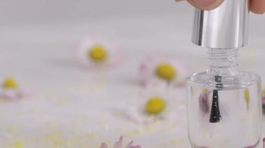 Bottle with transparent nail polish. High quality 4k footage