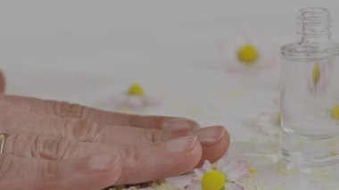 Females covers her nails with transparent nail paint. High quality 4k footage