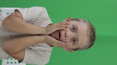 Boy of 9 years behaves very surprised. Closeup. High quality footage