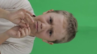 Boy of 9 years does not accept something. Closeup. High quality footage