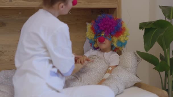 Medical Sister Professional Uniform Red Nose Plays Boy His Hospital — Stockvideo