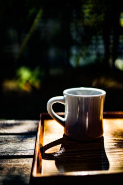 Coffee cup on the terrace seat. Shooting Location: Kamakura City, Kanagawa Prefecture