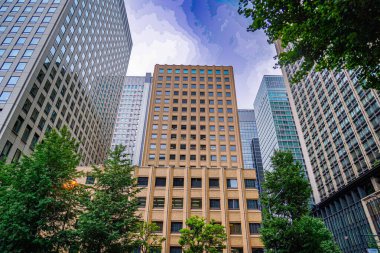 city ??buildings and blue sky. Shooting Location: Chiyoda ward, Tokyo clipart