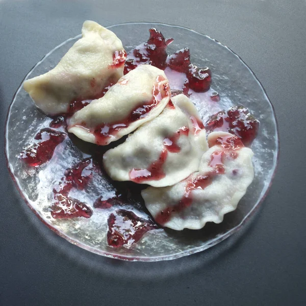 stock image dumplings with berries, cherries and jam