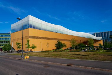 HELSINKI, FINLAND - JULY 7 2024: The Helsinki Central Library Oodi in the Kluuvi district on sunny summer day on July 7, 2024 in Helsinki, Finland. clipart