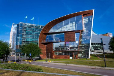 People walking in front of the Museum of contemporary art Kiasma, part of Finnish National Gallery on July 7, 2024 in Helsinki, Finland. clipart