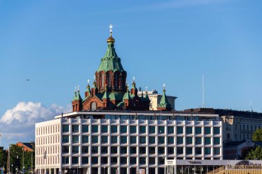 Cityscape with Eastern Orhodox Uspenski cathedral, Kauppatori in Etelasatama south harbour on July 5, 2024 in Helsinki, Finland. clipart