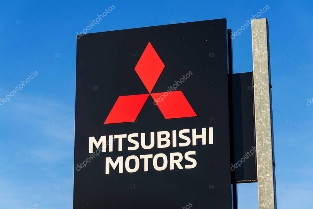Mitsubishi motors company logo in front of dealership building on April 12, 2025 in Prague, Czech republic.