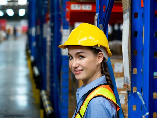 Stock image Foreman female woman yellow hardhat helmet safety engineer industry professional look at camera happy smile lady beautiful portrait young adult staff businesswoman labor foreman pretty warehouse