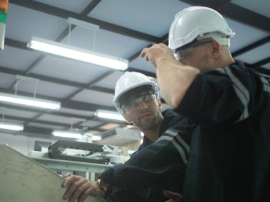 Two person engineer staff labor employee manager white hardhat helmet work job occupation talk speak discussion industry technology cnc steel gear factory report male engineer foreman project site    