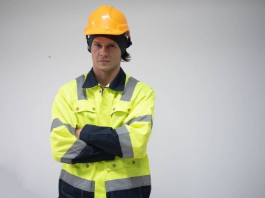 Staff labor engineer yellow hardhat helmet safety person arm cross look at camera white isolated background copy space work job occupation construction design portrait manager architect manufacturing 