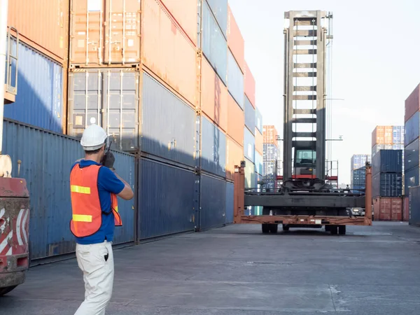 stock image Labor staff person white hardhat helmet safety talkie walkie speak discussion talk teamwork forklift container import export cargo terminal manufacturing custom stock commercial driver shipping site